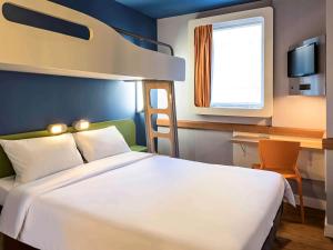 Кровать или кровати в номере ibis budget RJ Praia de Botafogo