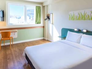 Кровать или кровати в номере ibis budget RJ Praia de Botafogo