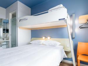 Una cama o camas en una habitación de ibis budget Iquique