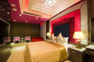 Postel nebo postele na pokoji v ubytování Zheng Yi Classic Hotel & Motel