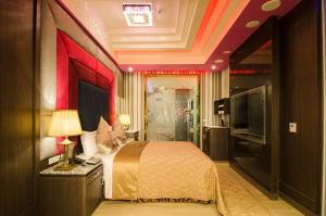 Postel nebo postele na pokoji v ubytování Zheng Yi Classic Hotel & Motel