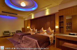Postel nebo postele na pokoji v ubytování Zheng Yi Classic Hotel & Motel