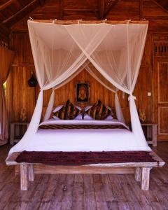 Postel nebo postele na pokoji v ubytování Kidem Ubud Villas