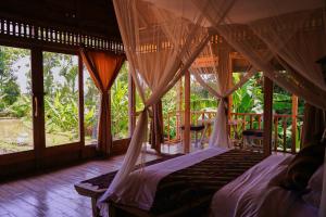 Postel nebo postele na pokoji v ubytování Kidem Ubud Villas