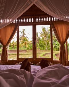 Postel nebo postele na pokoji v ubytování Kidem Ubud Villas