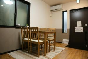 a conference room with a table and chairs in it at KYOTO STATION HOUSE in Kyoto +16 photos