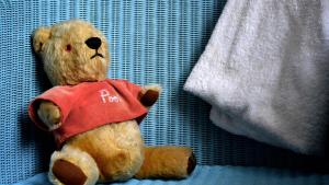 a brown teddy bear sitting on a blue blanket at Holiday Inn Express London Gatwick Crawley, an IHG Hotel in Crawley
