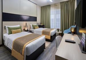 Cama ou camas em um quarto em TIME Express Hotel Al Khan