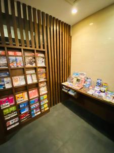 a book store with books on display on shelves at Ueno Touganeya Hotel in Tokyo