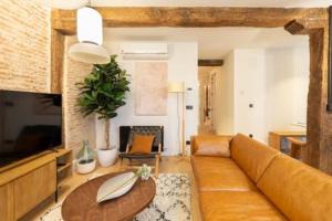 TV a/nebo společenská místnost v ubytování Santiago by Staynnapartments