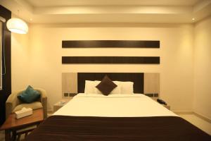 Rúm í herbergi á D Wayfarer Inn Resort