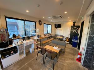 a room with a kitchen and a table and chairs at TOKYO-W-INN Asakusa in Tokyo
