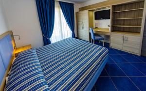 Ένα ή περισσότερα κρεβάτια σε δωμάτιο στο Astro Suite Hotel