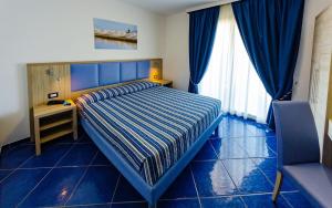 Ένα ή περισσότερα κρεβάτια σε δωμάτιο στο Astro Suite Hotel