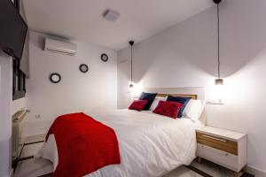 Cama o camas de una habitación en Apartamentos Hervás Suites