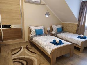 Posteľ alebo postele v izbe v ubytovaní Silver Apartman
