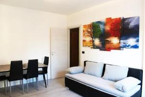 a living room with a couch and a table at J&M HOUSE -Fronte Ospedale- in Udine +12 photos