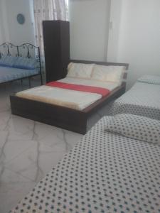 a bedroom with two twin beds in a room at VILLA ARIANNA in Wattala