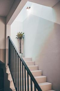 a staircase with a potted plant on the wall at J Residence in Banting