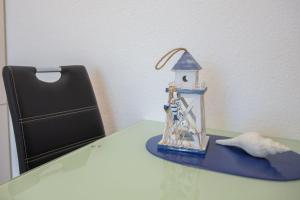 a figurine of a lighthouse sitting on a table at Haus Meeresglück Seehase in Dahme