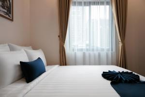 Postelja oz. postelje v sobi nastanitve Patel Hotel Hanoi