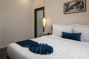 Postelja oz. postelje v sobi nastanitve Patel Hotel Hanoi