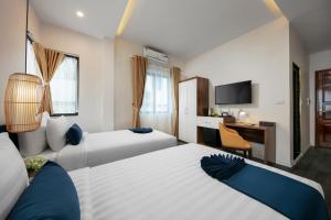 Postelja oz. postelje v sobi nastanitve Patel Hotel Hanoi