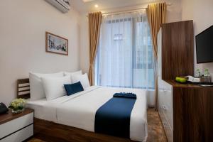 Postelja oz. postelje v sobi nastanitve Patel Hotel Hanoi