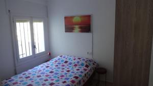 A bed or beds in a room at Canta el viento Még 37 kép
