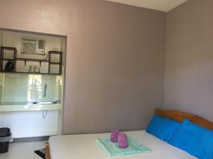 Postel nebo postele na pokoji v ubytování Panglao Rainbow Inn
