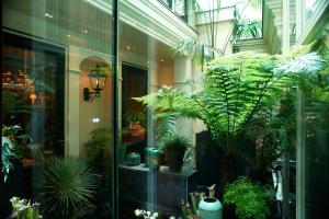 a room filled with lots of plants in a building at Hotel Estheréa in Amsterdam