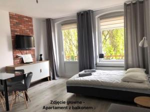 Posteľ alebo postele v izbe v ubytovaní Apartament przy Parku Zdrojowym