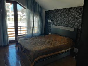 Posteľ alebo postele v izbe v ubytovaní Cottage Igloo Bakuriani