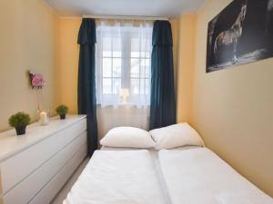 Posteľ alebo postele v izbe v ubytovaní VacationClub – Osiedle Podgórze 1E Apartament 19 + 2 fotografie