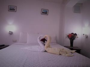 Voodi või voodid majutusasutuse Hostal Tu Hogar toas