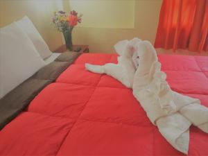 Voodi või voodid majutusasutuse Hostal Tu Hogar toas