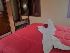 Voodi või voodid majutusasutuse Hostal Tu Hogar toas