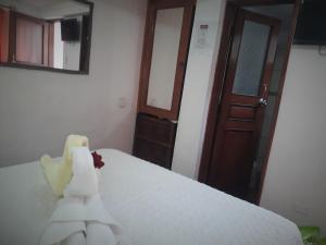 Voodi või voodid majutusasutuse Hostal Tu Hogar toas