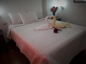 Voodi või voodid majutusasutuse Hostal Tu Hogar toas