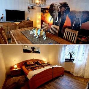 ein Schlafzimmer mit einem Elefantenmalerei an der Wand in der Unterkunft Karibu in Tiefenthal
