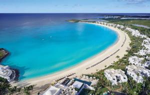 an aerial view of a beach with buildings and the ocean at Cap Juluca, A Belmond Hotel, Anguilla in West End Village