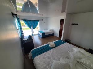 Voodi või voodid majutusasutuse Hotel Cally toas