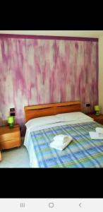 Postel nebo postele na pokoji v ubytování Caravaggio Apartments