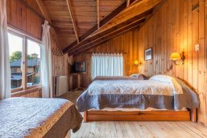 Voodi või voodid majutusasutuse Cabañas Mapulay toas +37 fotot