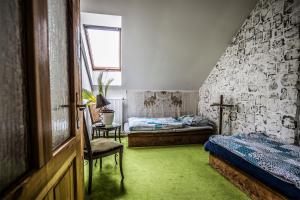 Postel nebo postele na pokoji v ubytování Statek Luníkov