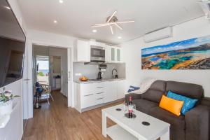 a living room with a couch and a table at Marlin II Puerto del Carmen in Puerto del Carmen