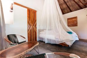 Uma cama ou camas num quarto em Bohemia Beach Tayrona