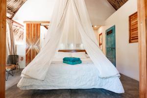 Uma cama ou camas num quarto em Bohemia Beach Tayrona