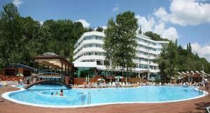 a large swimming pool in front of a large building at Hotel Arabella Beach in Albena +33 photos