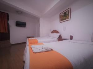 Voodi või voodid majutusasutuse Hostal Tu Hogar toas